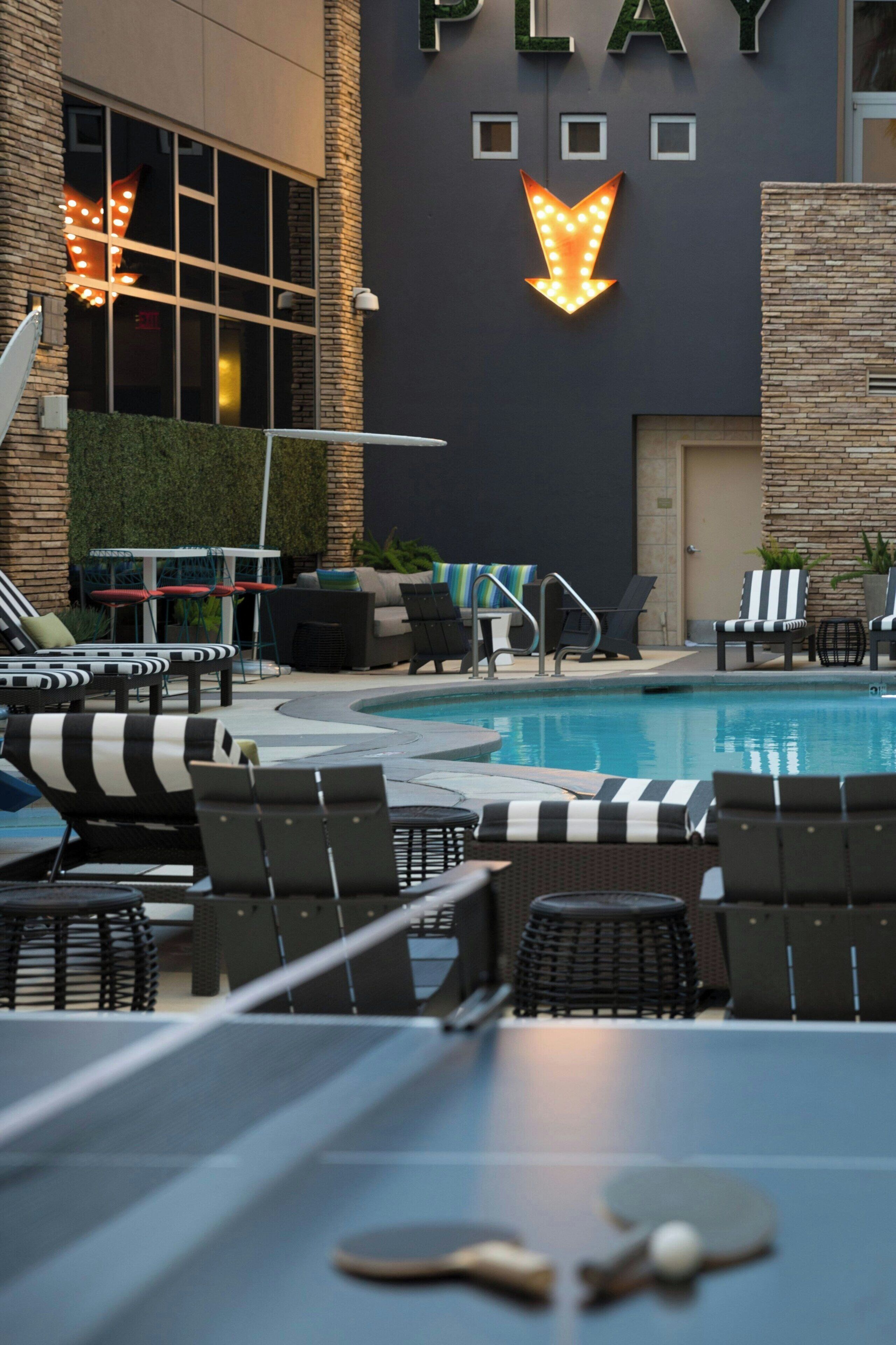 outdoor pool, open 6:00 am to midnight, pool umbrellas, pool loungers