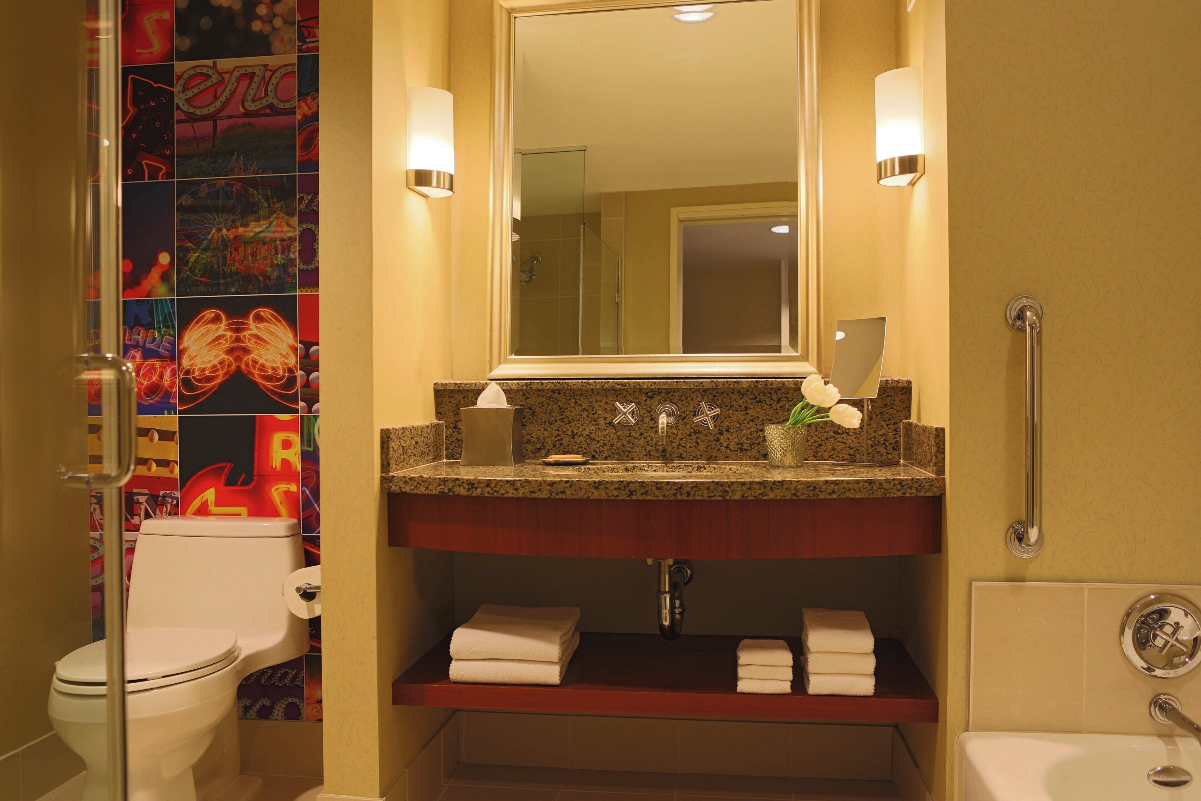 separate bathtub and shower, designer toiletries, hair dryer, towels