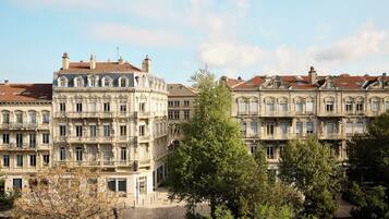 A historic building with classical architecture, multiple balconies, and a central courtyard.