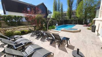 Seasonal outdoor pool, open 8:00 AM to 9:00 PM, pool umbrellas