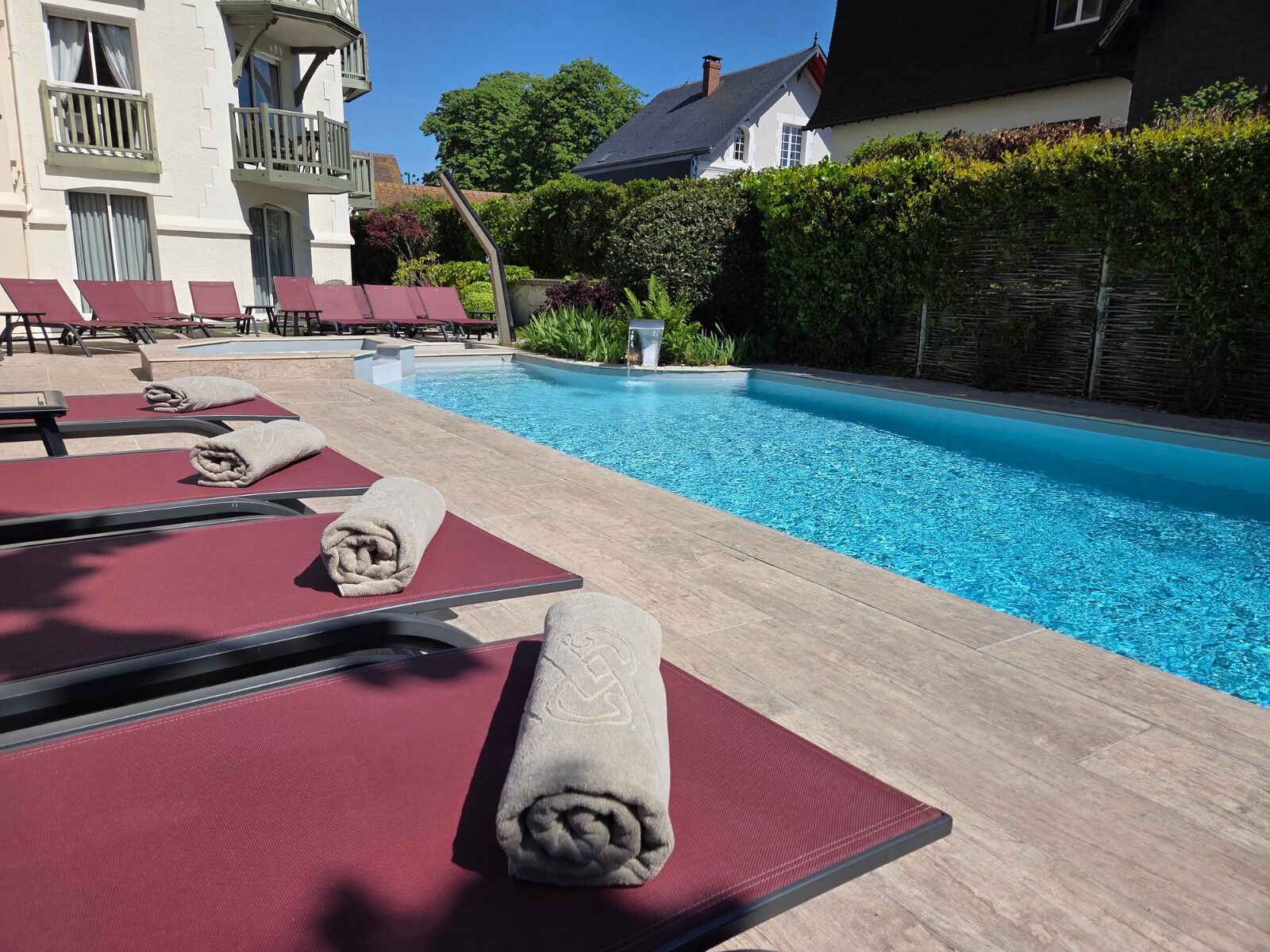 Seasonal outdoor pool, open 8:00 AM to 9:00 PM, pool umbrellas