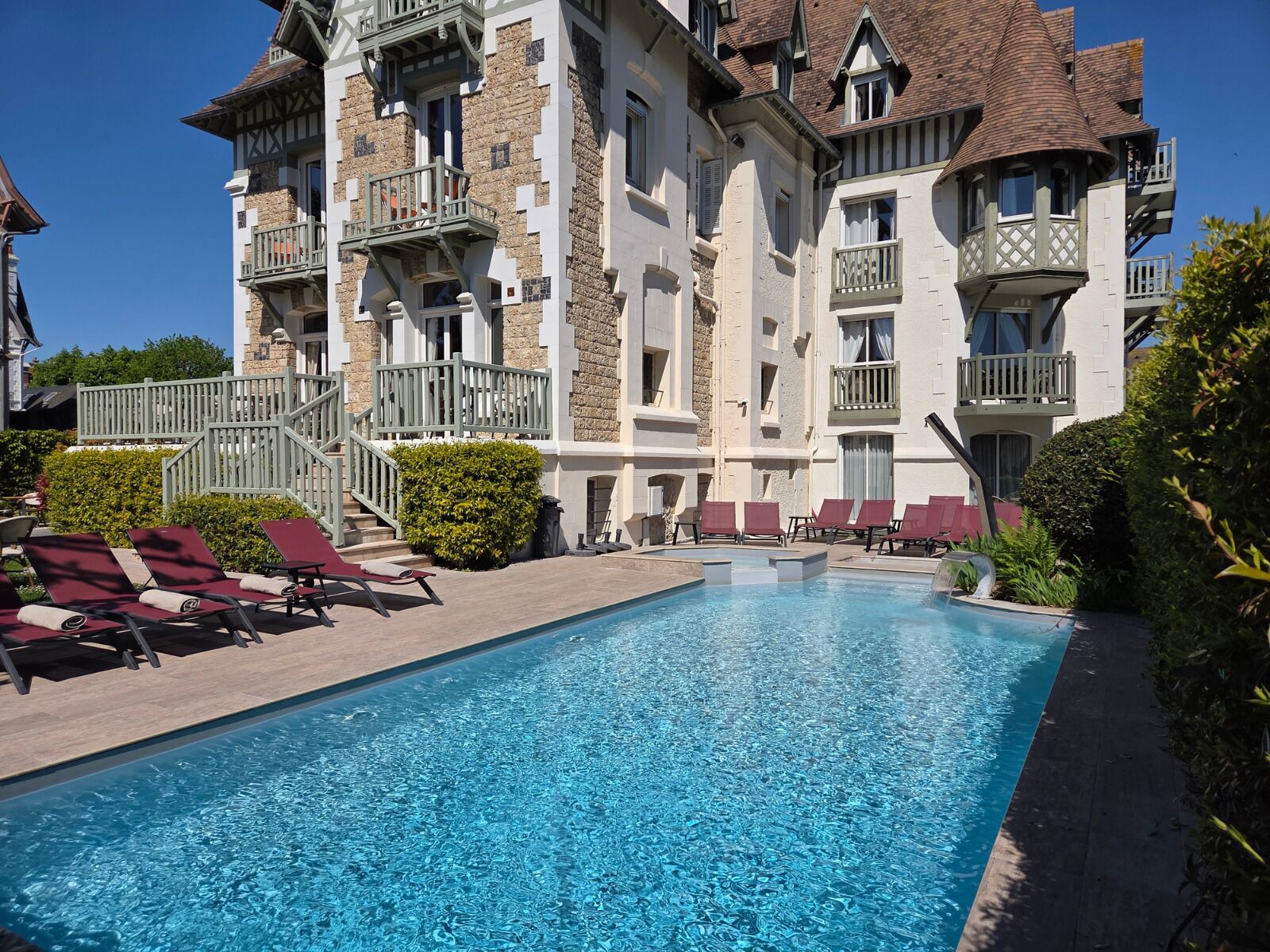 Seasonal outdoor pool, open 8:00 AM to 9:00 PM, pool umbrellas