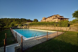 Outdoor pool, open 9 AM to 8 PM, pool umbrellas, pool loungers