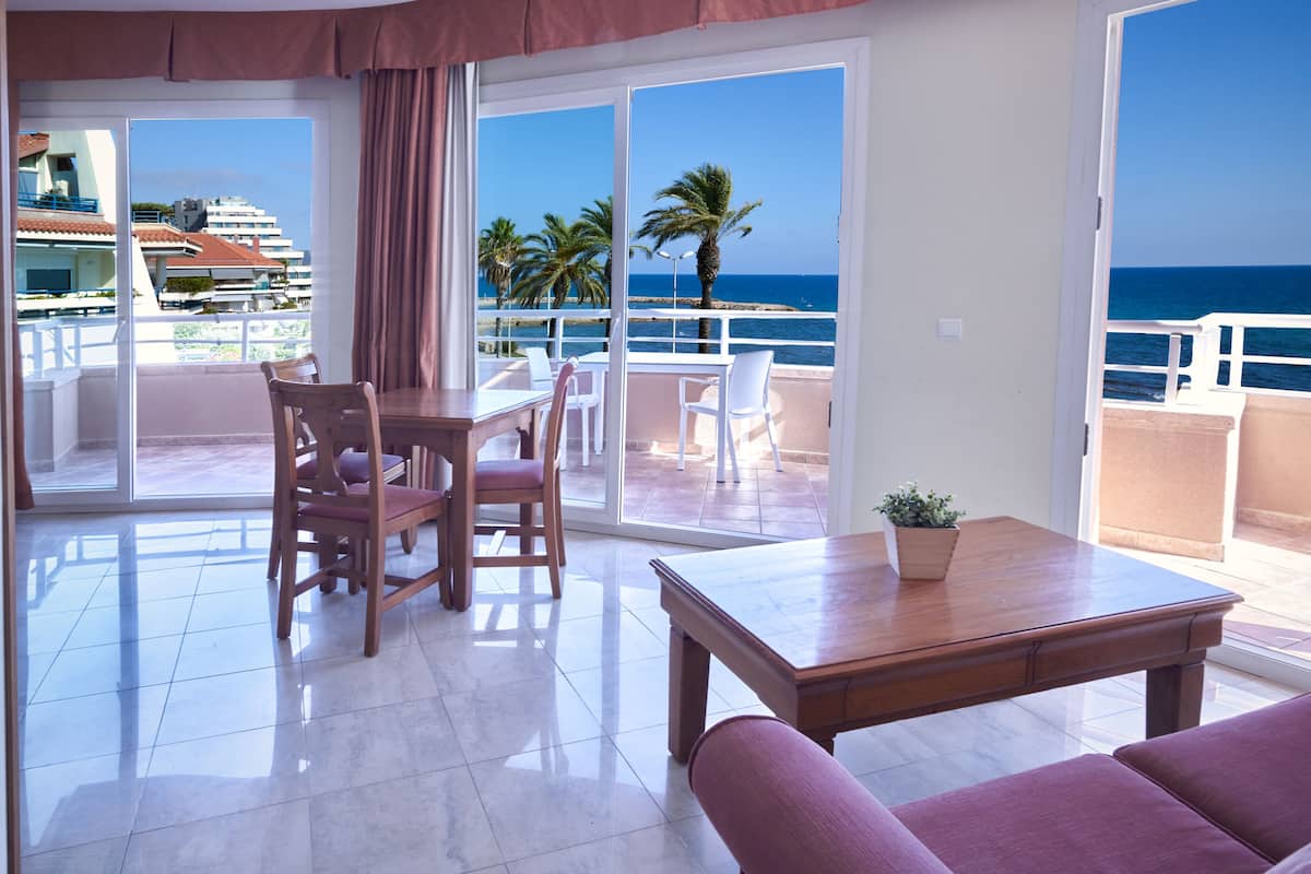superior apartment, sea view | living area | 26-inch flat-screen tv with satellite channels, tv, table football