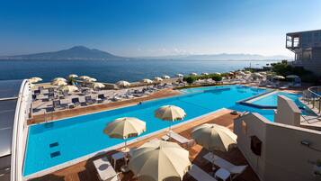 Outdoor pool, open 9:00 AM to 7:00 PM, pool umbrellas, sun loungers