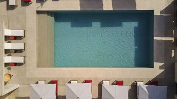 Seasonal outdoor pool, cabanas (surcharge), pool umbrellas