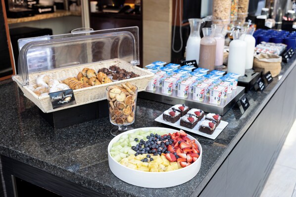 A buffet with various food items including pastries, fruits, and desserts. - Holiday Inn Express Santiago Las Condes by IHG (Santiago)