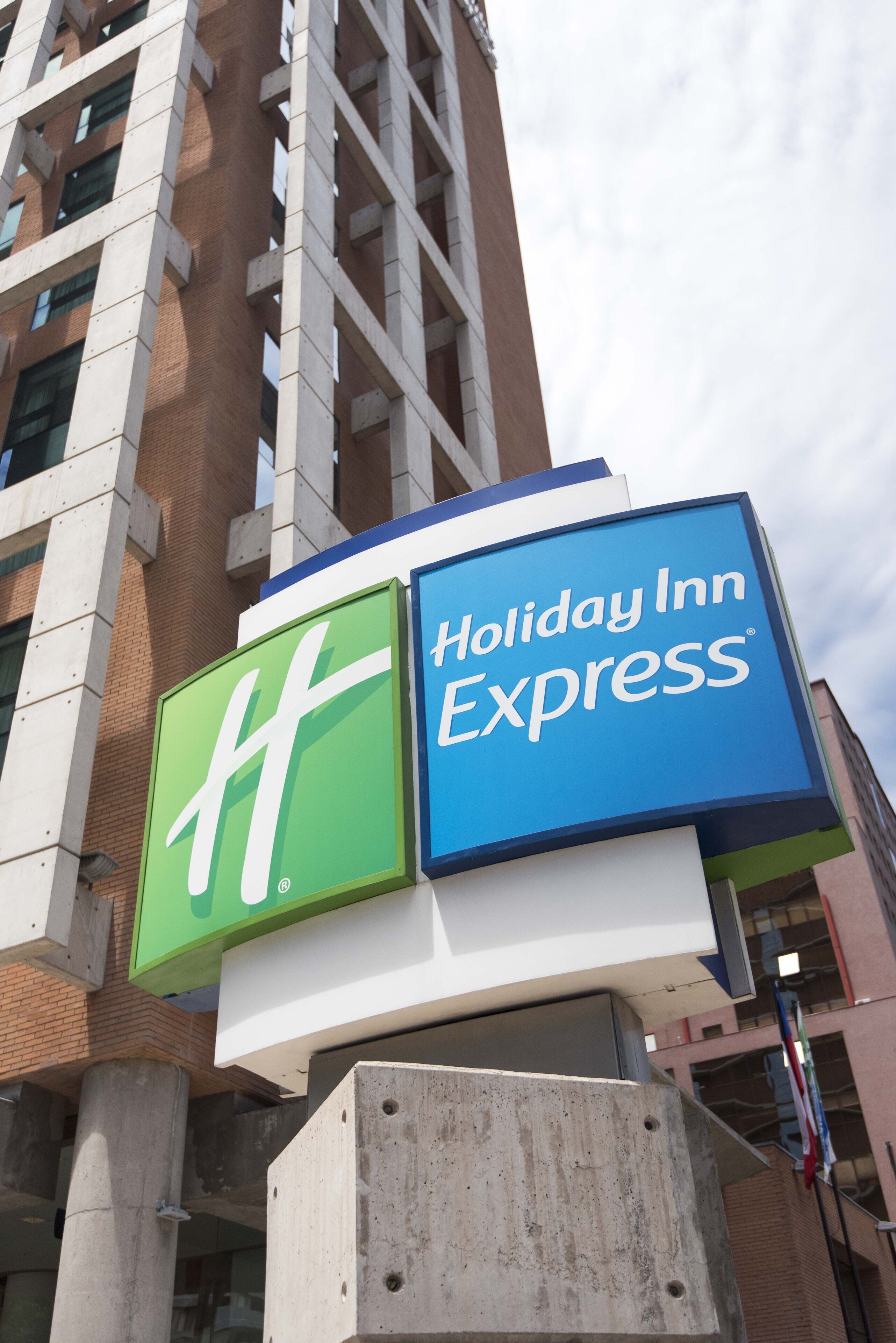A Holiday Inn Express sign mounted on a building.