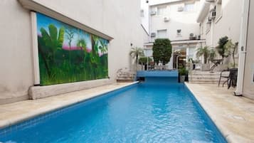 Outdoor pool, open noon to 6 PM, pool loungers