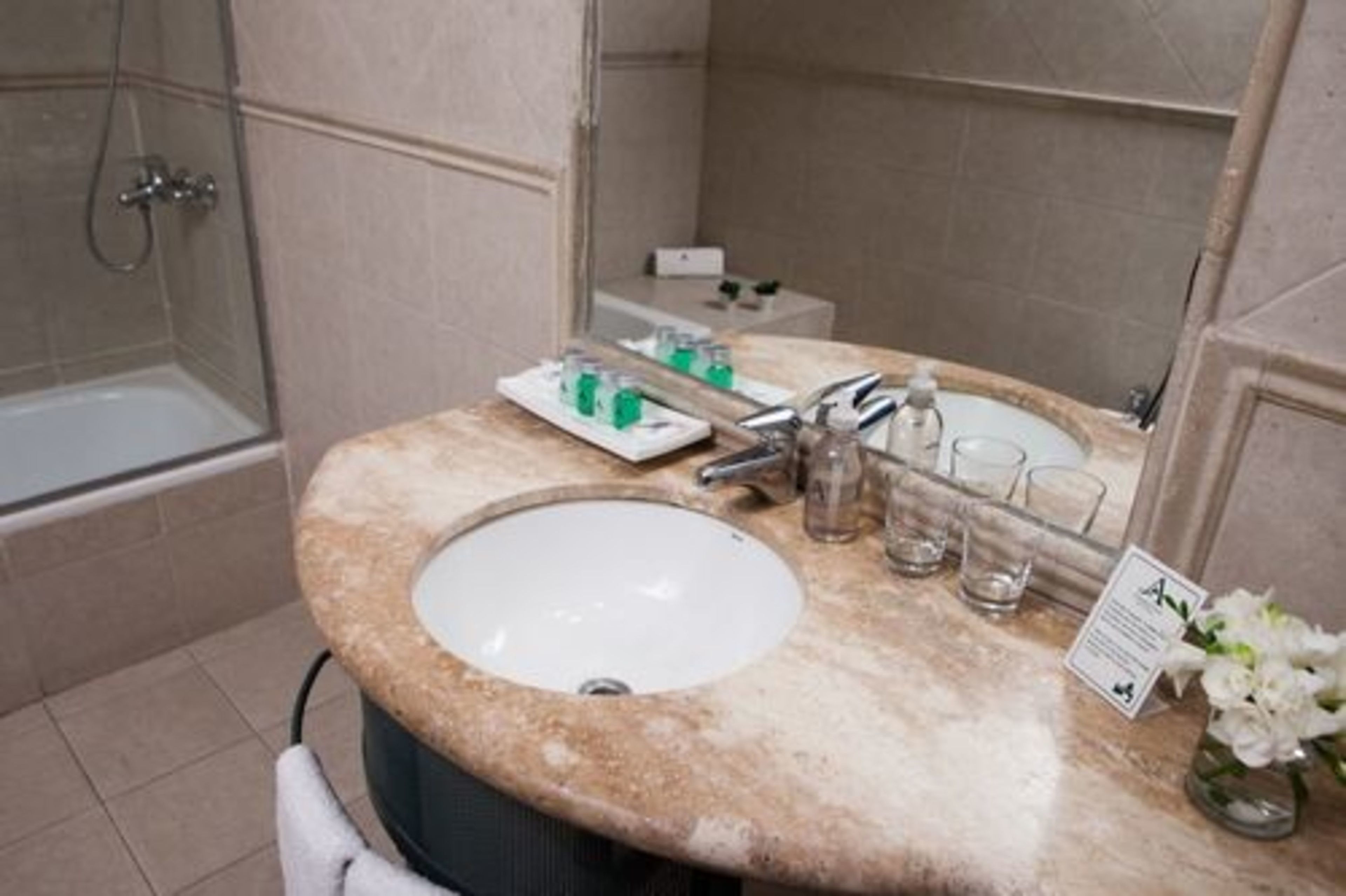 designer toiletries, hair dryer, bidet, towels