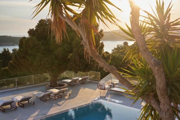 Outdoor pool, pool umbrellas, sun loungers