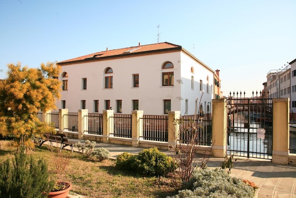 Traditional building with a symmetrical facade and evenly spaced windows.