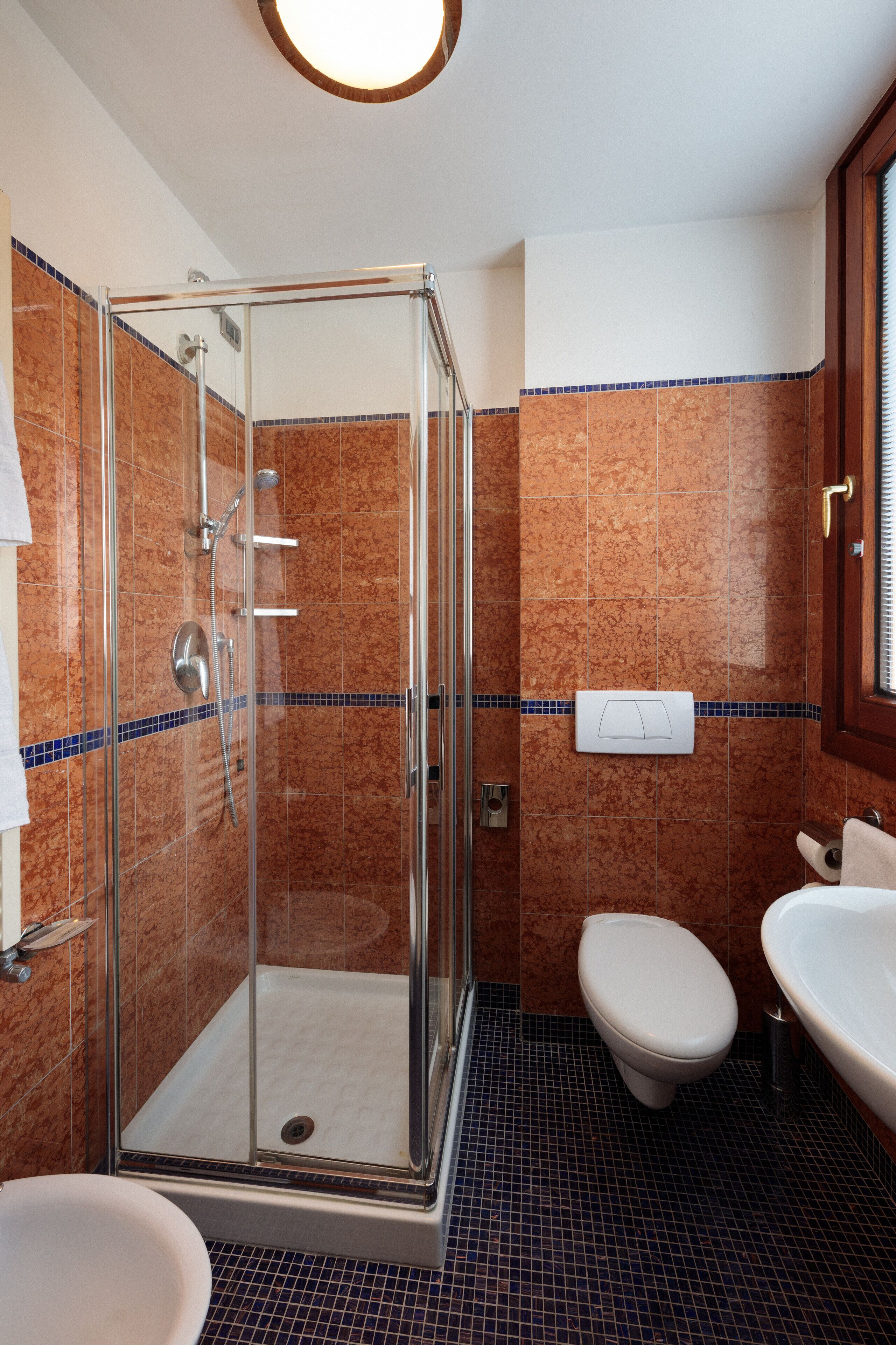 shower, hair dryer, bidet, towels