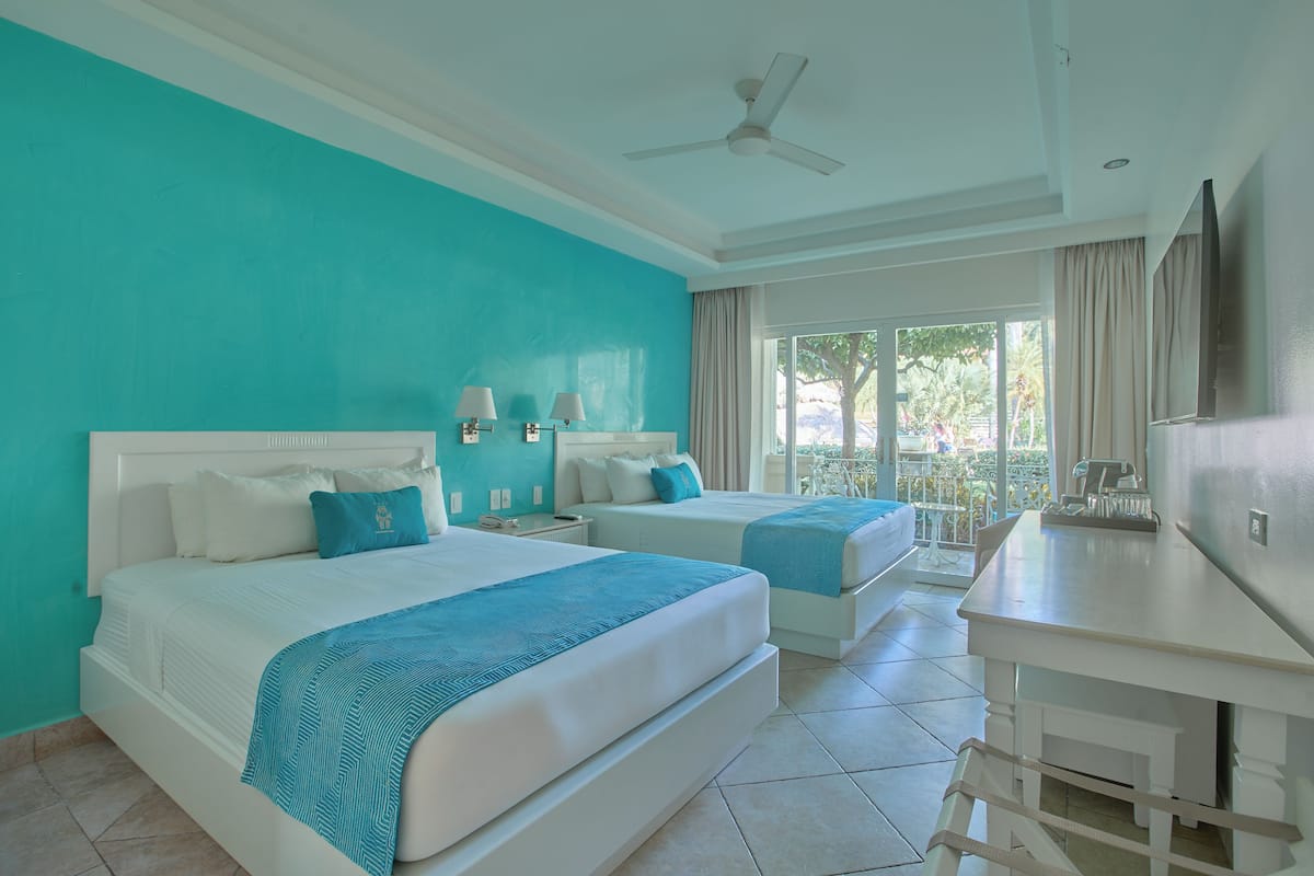 Family Pool View Queen Beds | Premium bedding, minibar, in-room safe, individually decorated