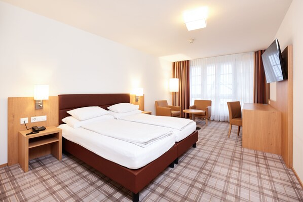 Twin Room | Minibar, in-room safe, desk, blackout drapes