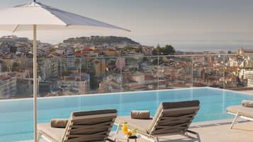 Indoor pool, outdoor pool, pool umbrellas, pool loungers
