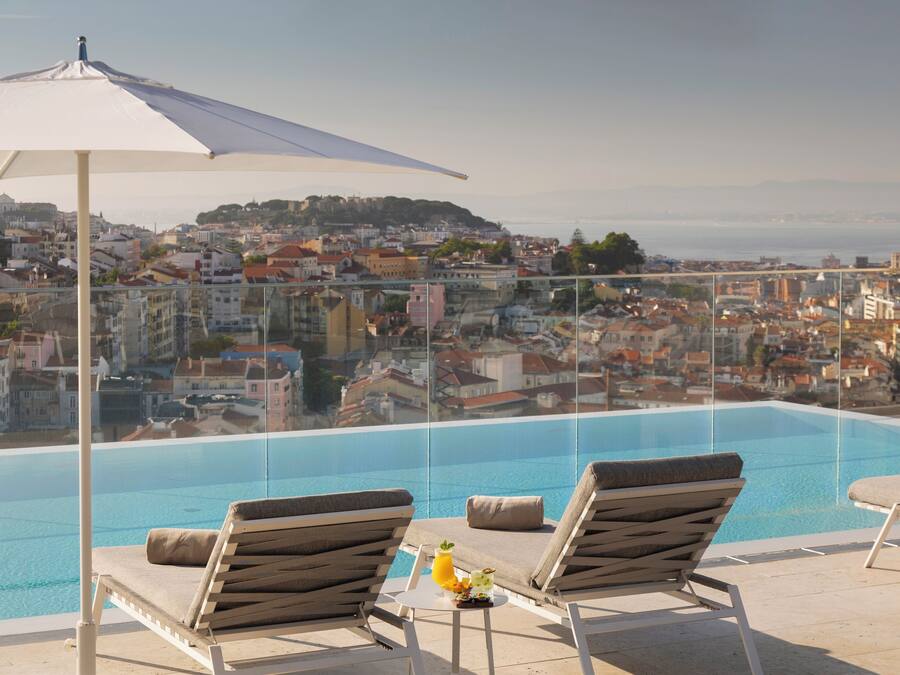 Indoor pool, outdoor pool, pool umbrellas, pool loungers