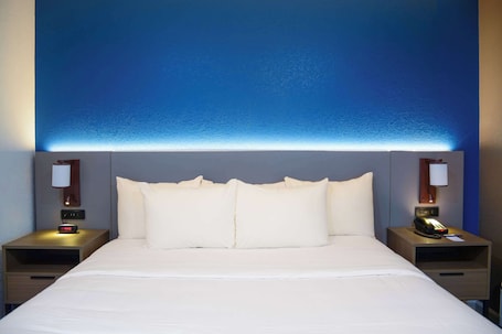 Desk, laptop workspace, blackout drapes, iron/ironing board