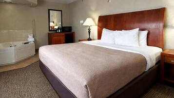 Room, 1 King Bed, Jetted Tub | Desk, soundproofing, iron/ironing board, free cribs/infant beds