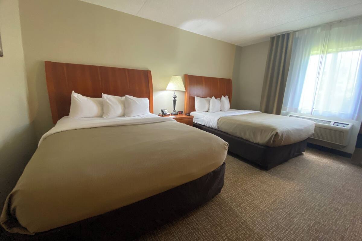 double room, 2 queen beds | desk, soundproofing, iron/ironing board, free cots/infant beds