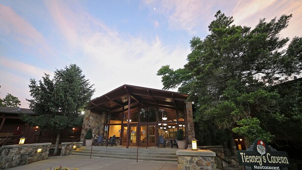 A building with a stone facade, a wooden roof, and a sign that reads "Tierney's Tavern Restaurant." - Carter Caves State Resort Park (Olive Hill)