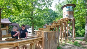 A wooden structure with a water tower and wooden boxes, likely part of a park or recreational area. - Carter Caves State Resort Park (Olive Hill)