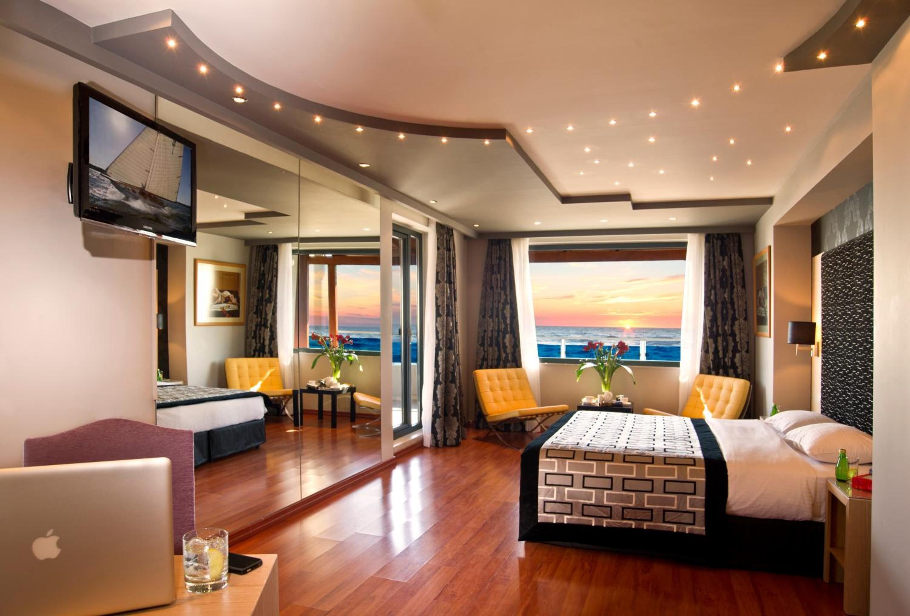 Deluxe Suite, Partial Sea View | Premium bedding, in-room safe, desk, blackout curtains