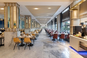 A spacious restaurant with a long counter, marble flooring, and modern decor. - Limak Atlantis De Luxe Hotel & Resort - All Inclusive (Serik)