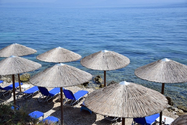 Private beach nearby, black sand, sun loungers, beach umbrellas