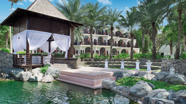 A resort with a pool, a gazebo, and a multi-story building with balconies. - JA Palm Tree Court, Dubai (Dubai)