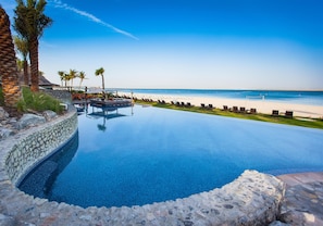 4 outdoor pools, open 9:00 AM to 6:00 PM, pool loungers