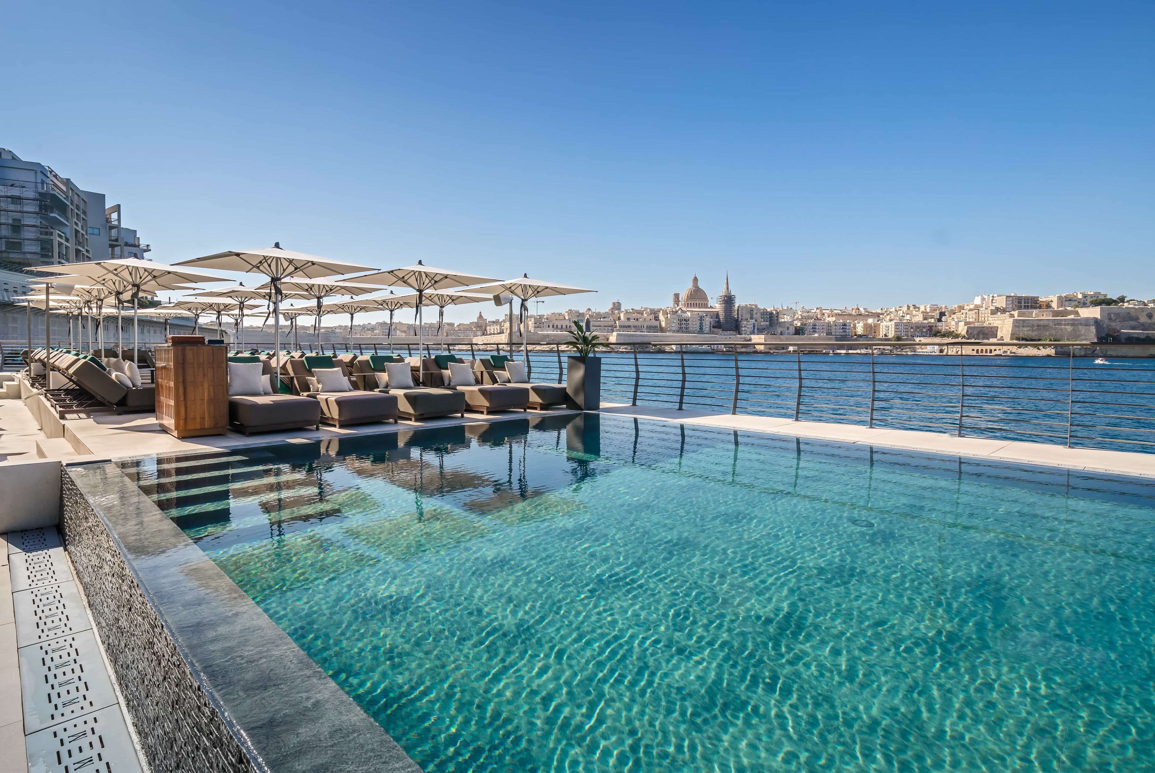 Indoor pool, outdoor pool, pool umbrellas, sun loungers