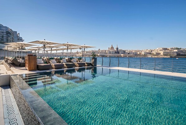 Indoor pool, outdoor pool, pool umbrellas, sun loungers