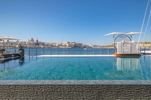 Indoor pool, outdoor pool, pool umbrellas, sun loungers