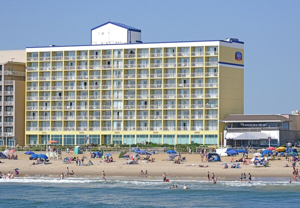 A large hotel with multiple balconies and a beach in front. - Fairfield Inn & Suites by Marriott Virginia Beach Oceanfront (Virginia Beach)