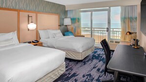 A hotel room with two beds, a desk, and a view of the ocean. - Fairfield Inn & Suites by Marriott Virginia Beach Oceanfront (Virginia Beach)