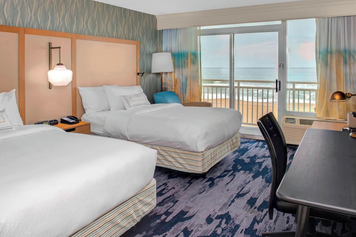 room, 2 queen beds, balcony, oceanfront | premium bedding, down duvets, iron/ironing board, free cots/infant beds