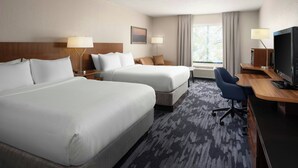A hotel room with two beds, a desk, a television, and a window with curtains. - Fairfield Inn & Suites by Marriott Tifton (Tifton)