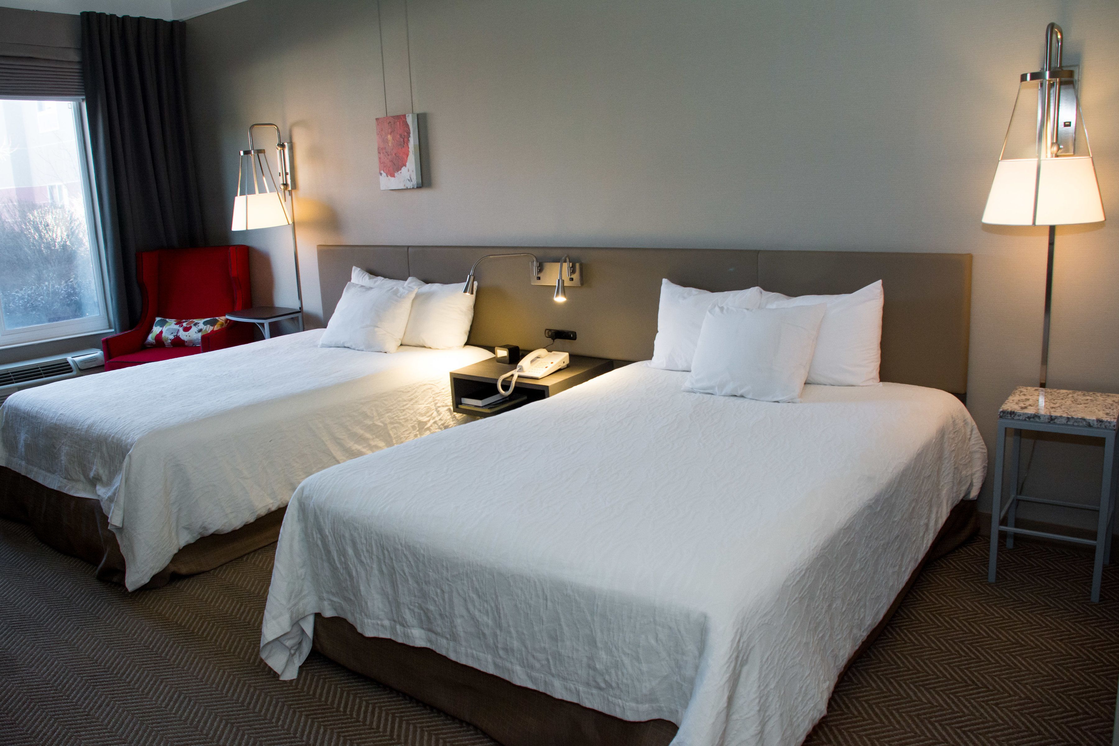 two queen beds | in-room safe, desk, iron/ironing board, free cots/infant beds