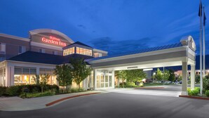 A Hilton Garden Inn with a well-lit entrance and a covered parking area. - Hilton Garden Inn Salt Lake City/Layton (Layton)