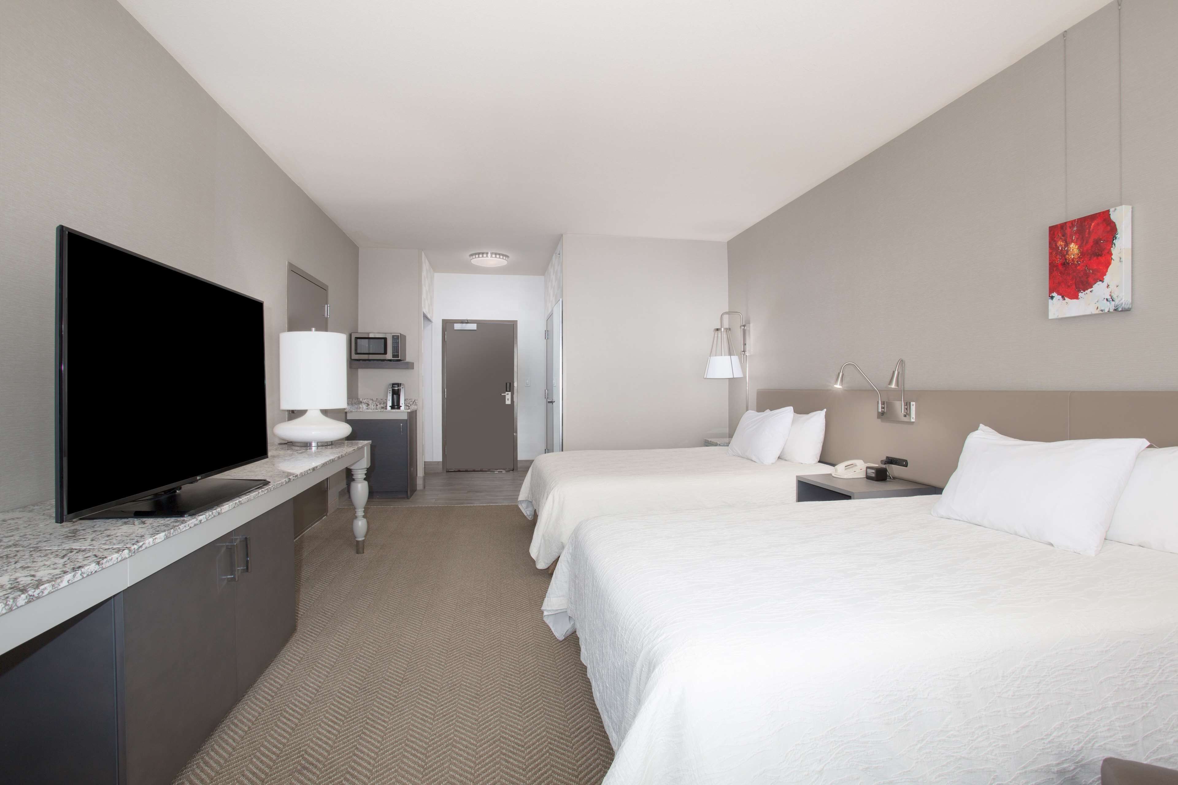 suite, 2 queen beds | in-room safe, desk, iron/ironing board, free cots/infant beds