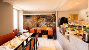 A restaurant with a buffet, seating area, and a mural. - Best Western Alba Hotel (Nice)