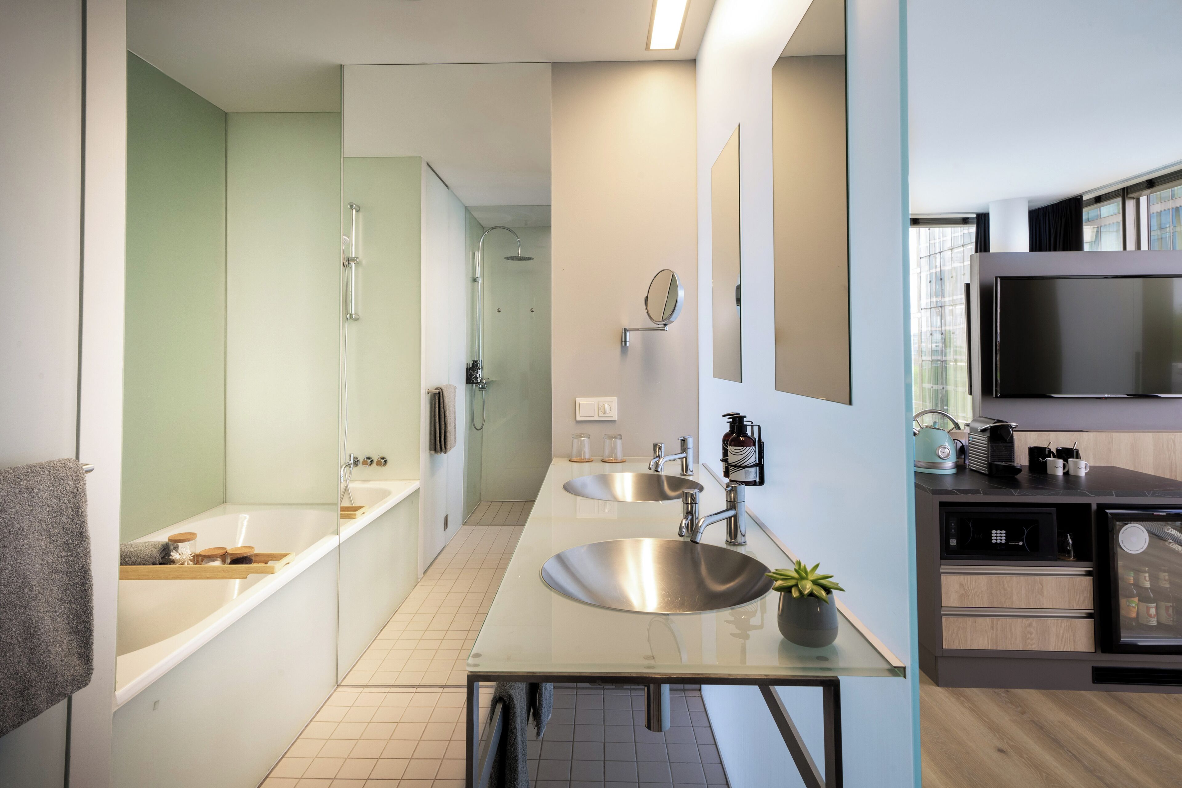 the loft | bathroom | deep-soaking bathtub, rainfall showerhead, free toiletries, hair dryer