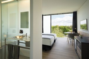 The New Innside Room | Minibar, blackout drapes, iron/ironing board, free cribs/infant beds