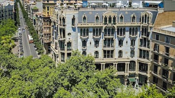 A multi-story building with ornate architectural details, including balconies and decorative moldings.