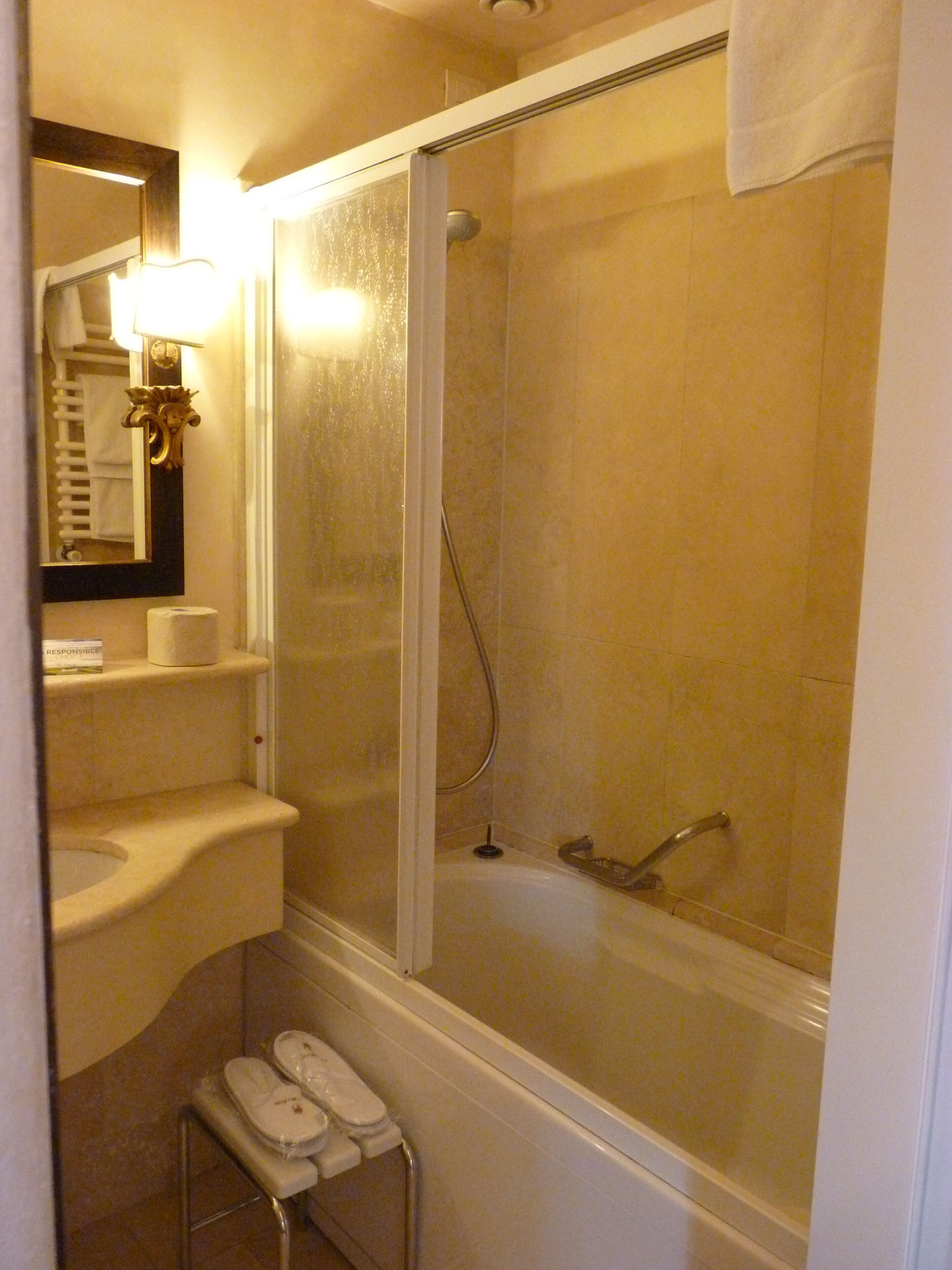 classic double room | bathroom | combined shower/bathtub, hair dryer, slippers, towels