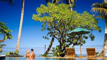 Outdoor pool, pool umbrellas, sun loungers