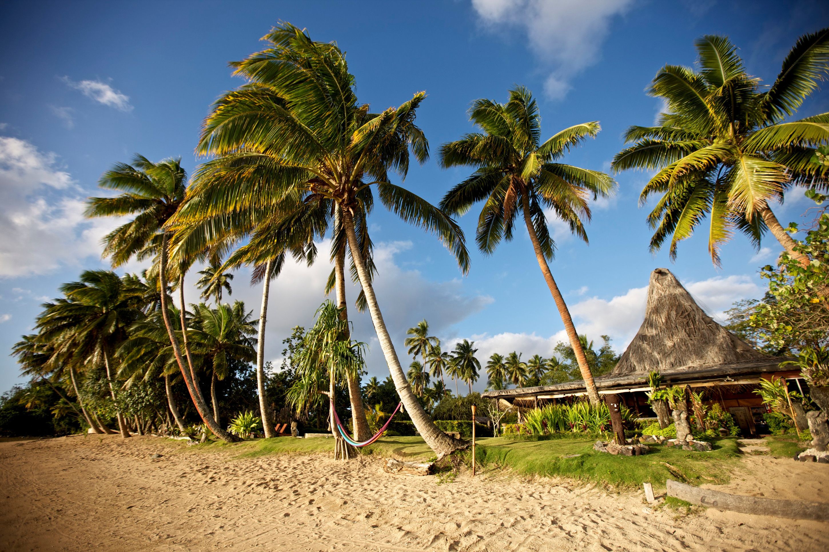 on the beach, sun-loungers, beach umbrellas, beach towels