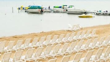 On the beach, sun loungers, beach towels