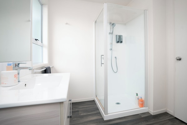 Deluxe Studio, 1 King Bed | Bathroom | Shower, hair dryer, towels, soap
